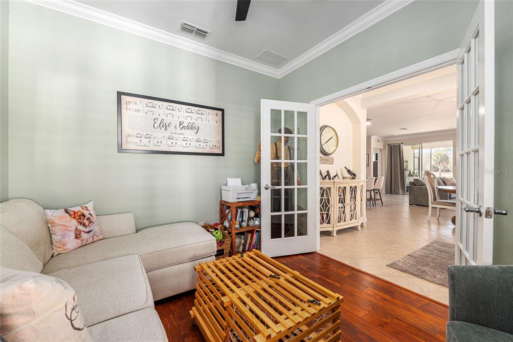 9595 Southwest 70th Loop Ocala, FL 34481 - Photo 22 of 100 a living room with furniture and a table