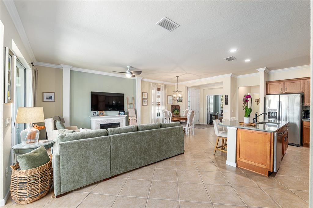 9595 Southwest 70th Loop Ocala, FL 34481 - Photo 29 of 100 a living room with furniture and a flat screen tv