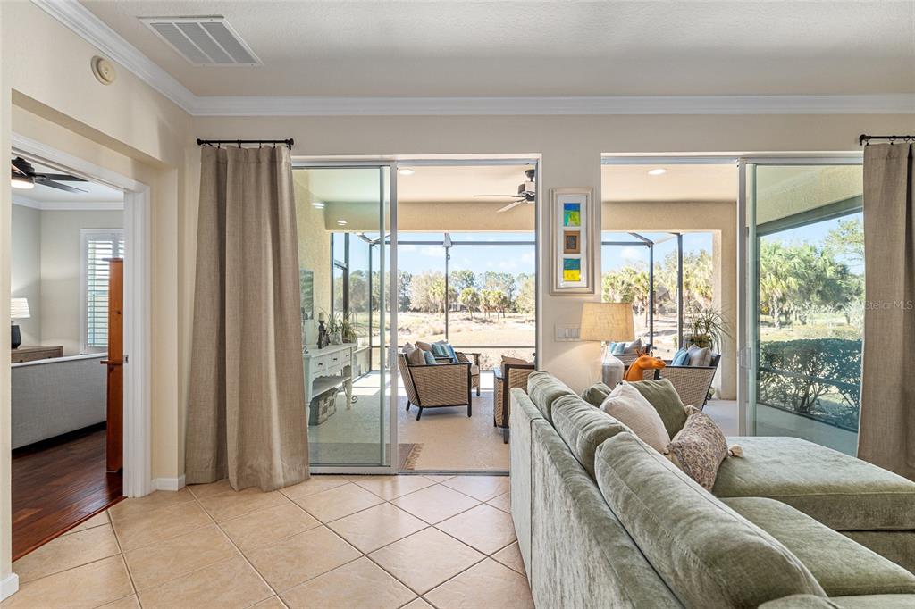 9595 Southwest 70th Loop Ocala, FL 34481 - Photo 31 of 100 a living room with furniture and large windows