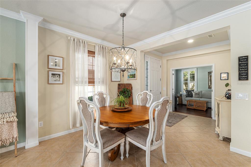 9595 Southwest 70th Loop Ocala, FL 34481 - Photo 33 of 100 a view of a dining room with furniture window and wooden floor