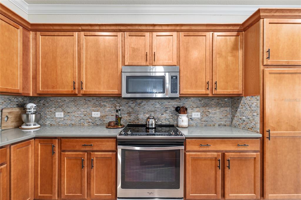 9595 Southwest 70th Loop Ocala, FL 34481 - Photo 38 of 100 a kitchen with stainless steel appliances granite countertop a refrigerator sink and microwave