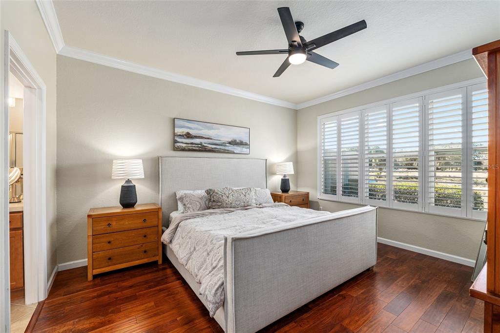 9595 Southwest 70th Loop Ocala, FL 34481 - Photo 48 of 100 a bedroom with a bed and a large window