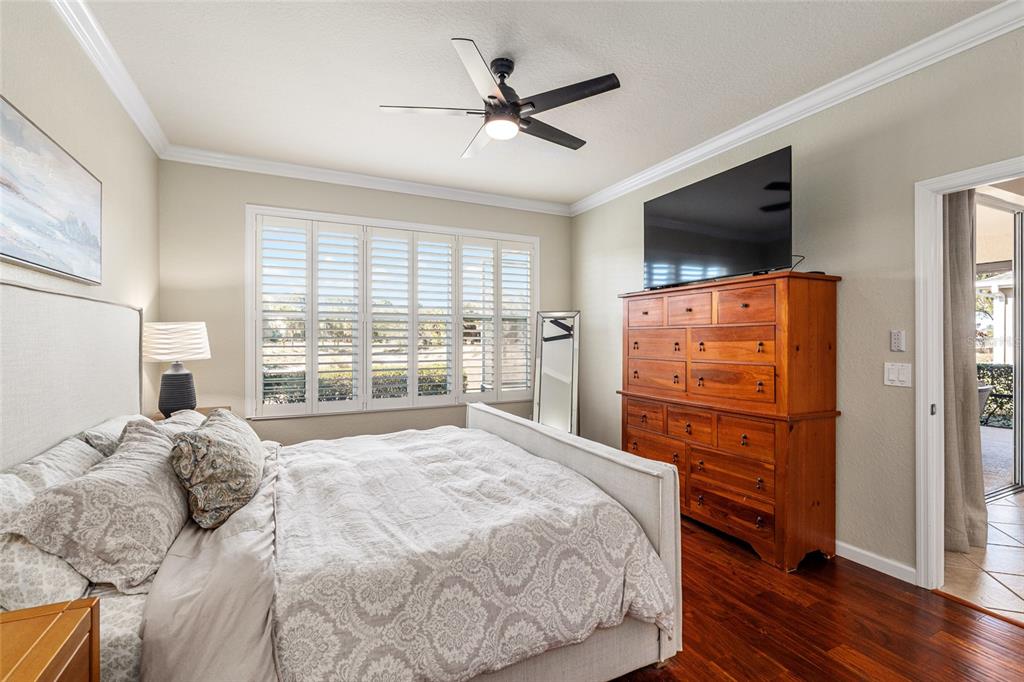 9595 Southwest 70th Loop Ocala, FL 34481 - Photo 49 of 100 a bedroom with a bed and a flat screen tv