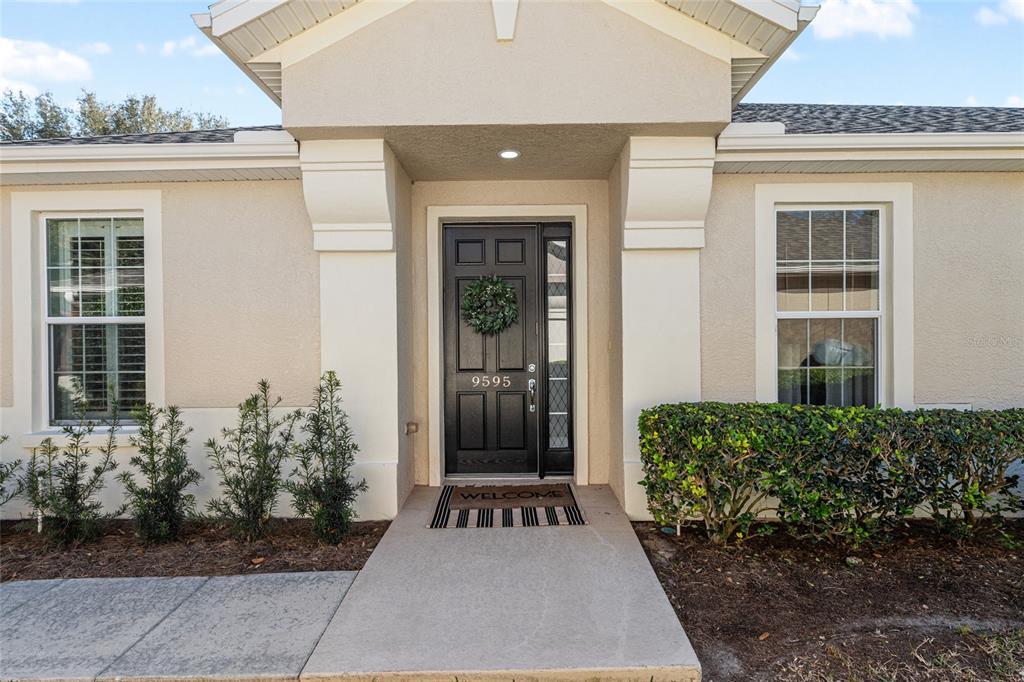 9595 Southwest 70th Loop Ocala, FL 34481 - Photo 5 of 100 a front view of a house