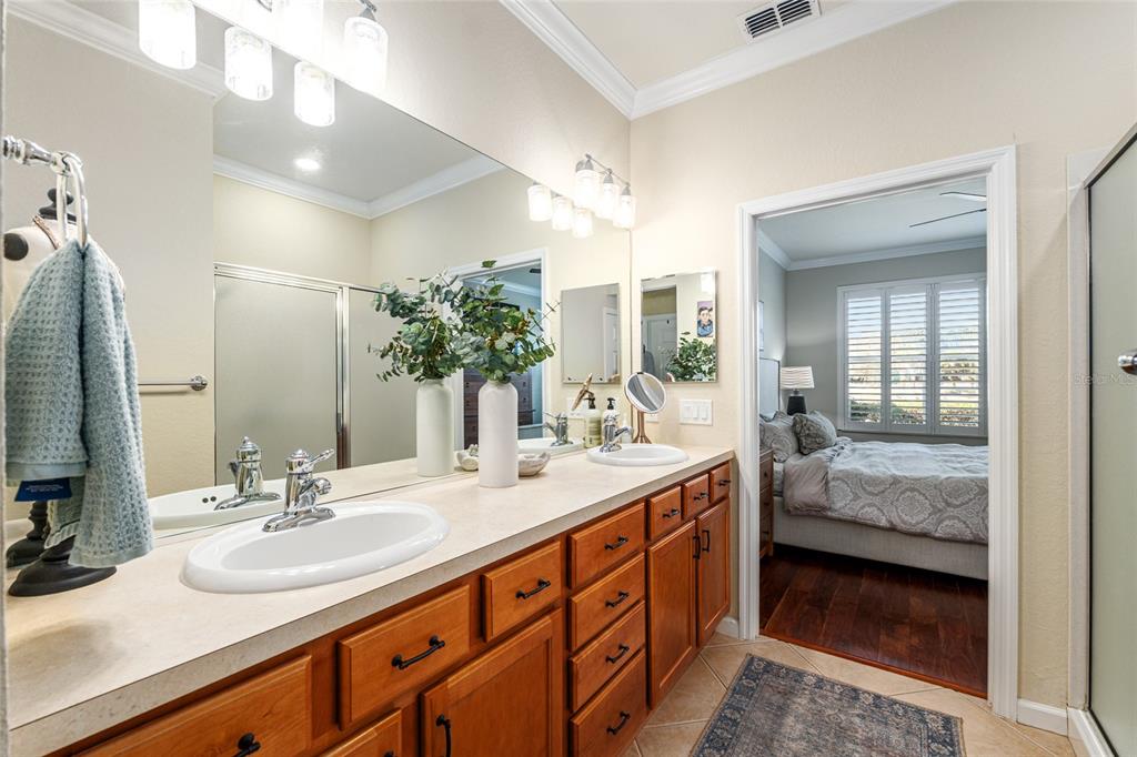9595 Southwest 70th Loop Ocala, FL 34481 - Photo 52 of 100 a en suite bathroom with double sink and a mirror