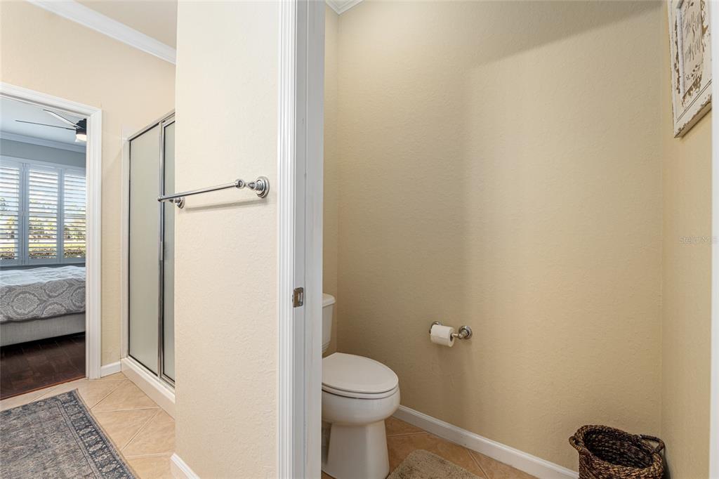 9595 Southwest 70th Loop Ocala, FL 34481 - Photo 54 of 100 a bathroom with a granite countertop toilet and a sink