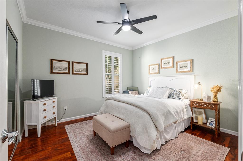 9595 Southwest 70th Loop Ocala, FL 34481 - Photo 57 of 100 a bedroom with a bed and a flat screen tv