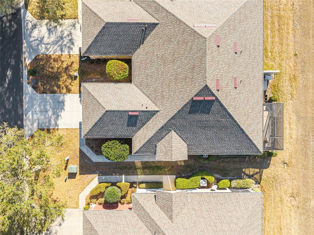 9595 Southwest 70th Loop Ocala, FL 34481 - Photo 62 of 100 an aerial view of a house with a swimming pool