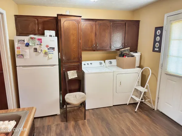 a white refrigerator freezer sitting in a kitchen