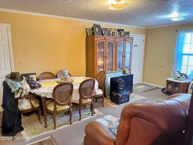 a bedroom with furniture and a fireplace