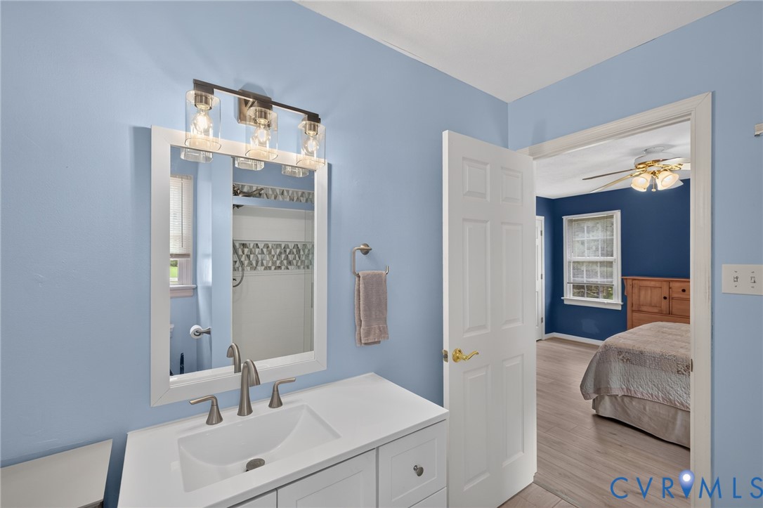 2335 Dorrell Road Aylett, VA 23009 - Photo 16 of 26 Bathroom vanity featuring a white rectangular sink