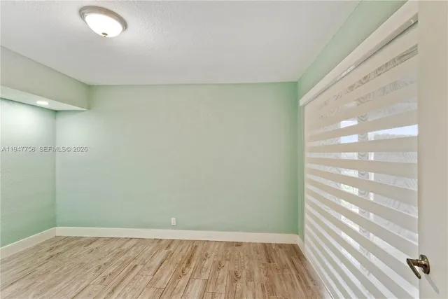 a view of staircase with white walls and windows