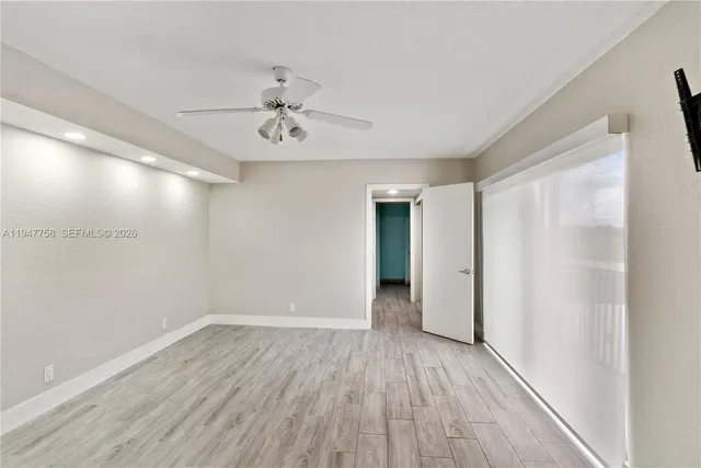 a view of a room with wooden floor and balcony