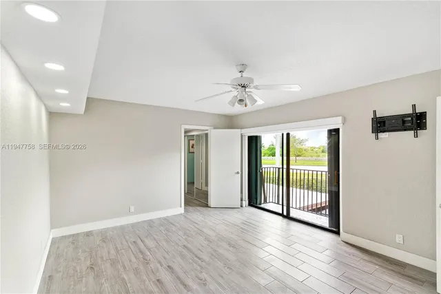 a view of a bathroom with a glass shower door