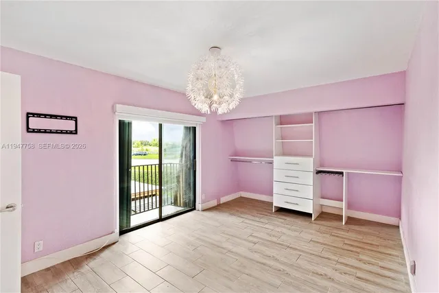 a bathroom with a granite countertop sink toilet mirror and bathtub