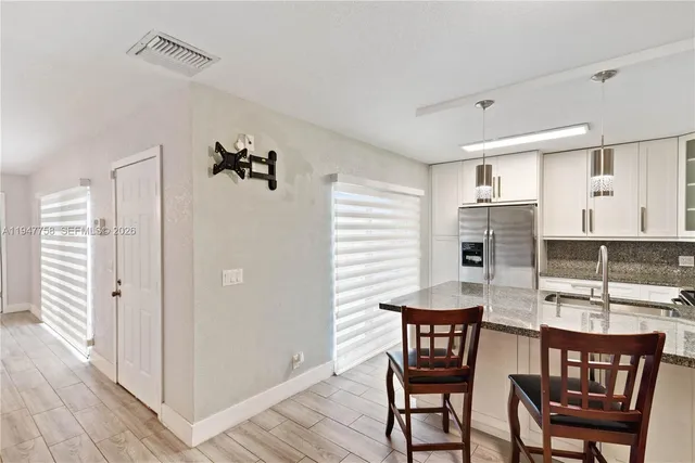 a view of a dining room with furniture