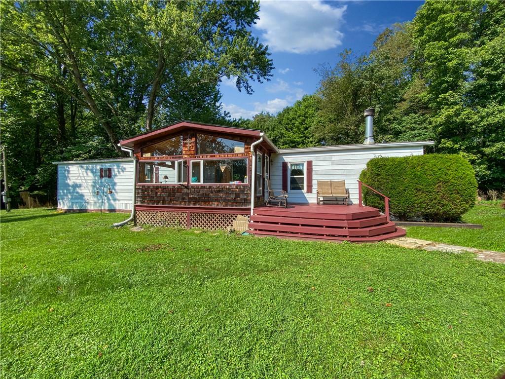 391 Garner Road Edinburg, PA 16116 - Photo 3 of 17 a front view of a house with a garden