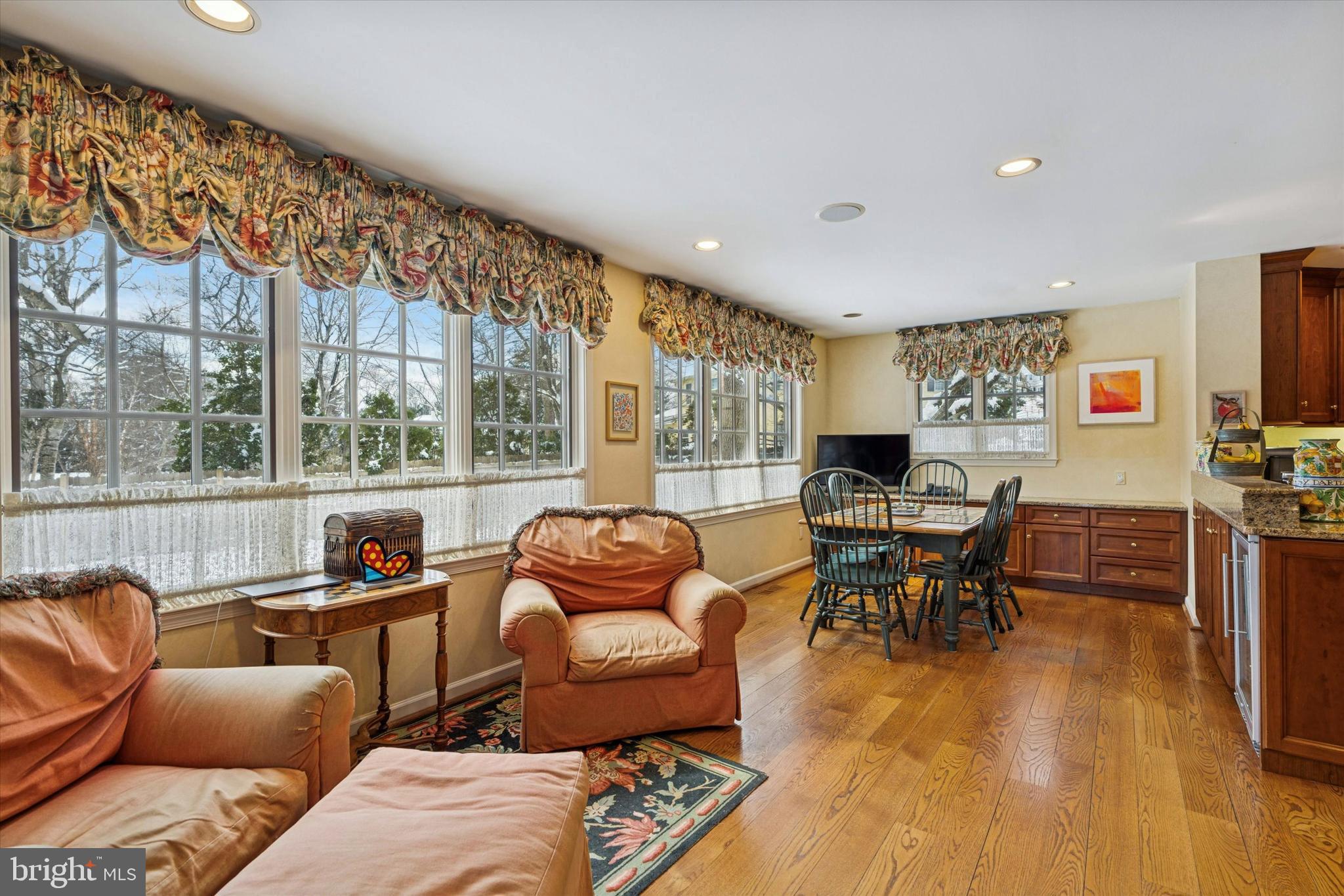 736 Woodleave Road Bryn Mawr, PA 19010 - Photo 17 of 44 a living room with furniture a rug and a floor to ceiling window