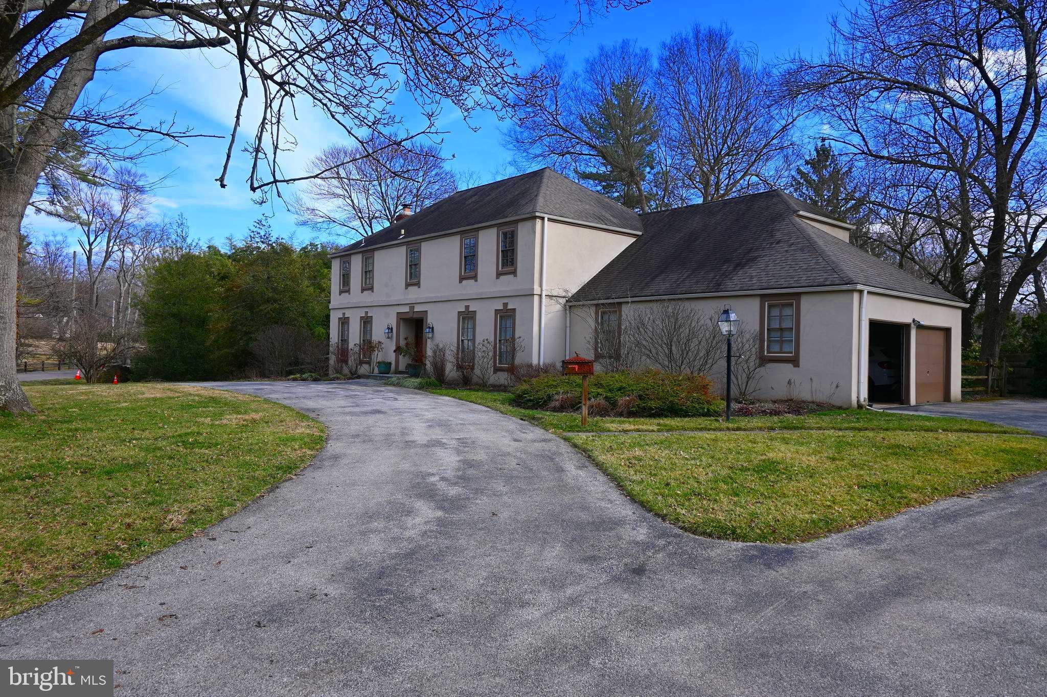 736 Woodleave Road Bryn Mawr, PA 19010 - Photo 2 of 44 a front view of a house with garden
