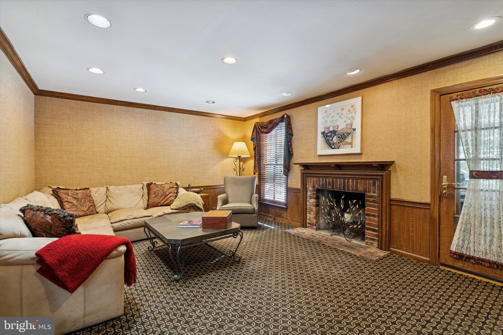 736 Woodleave Road Bryn Mawr, PA 19010 - Photo 22 of 44 a living room with furniture and a fireplace