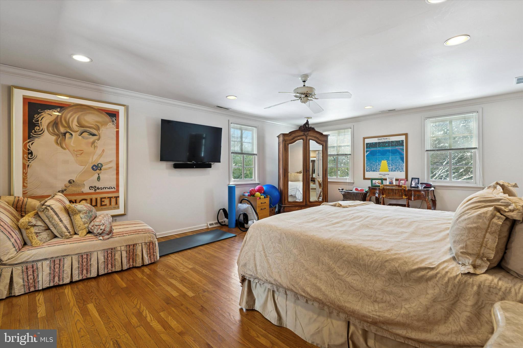 736 Woodleave Road Bryn Mawr, PA 19010 - Photo 24 of 44 a bed room with a bed a couch and a flat screen tv