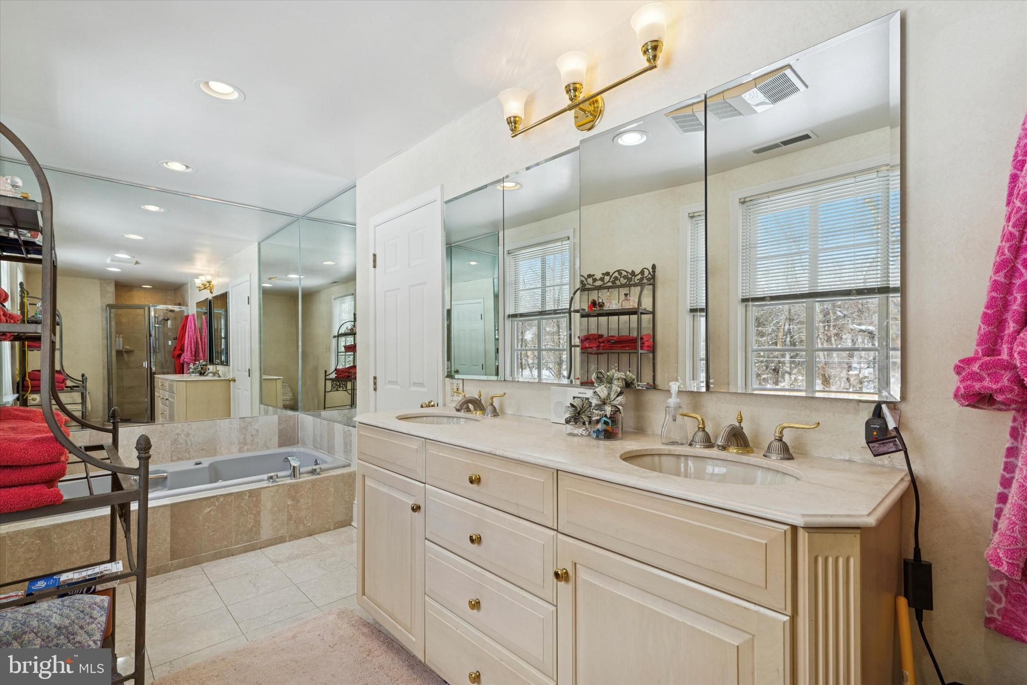 736 Woodleave Road Bryn Mawr, PA 19010 - Photo 27 of 44 a bathroom with a tub sink and mirror