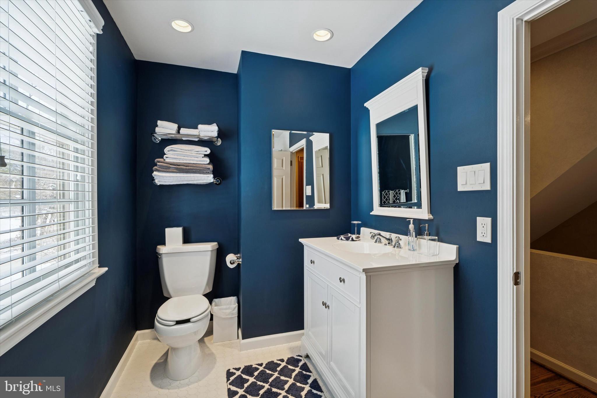 736 Woodleave Road Bryn Mawr, PA 19010 - Photo 28 of 44 a bathroom with a toilet sink and mirror