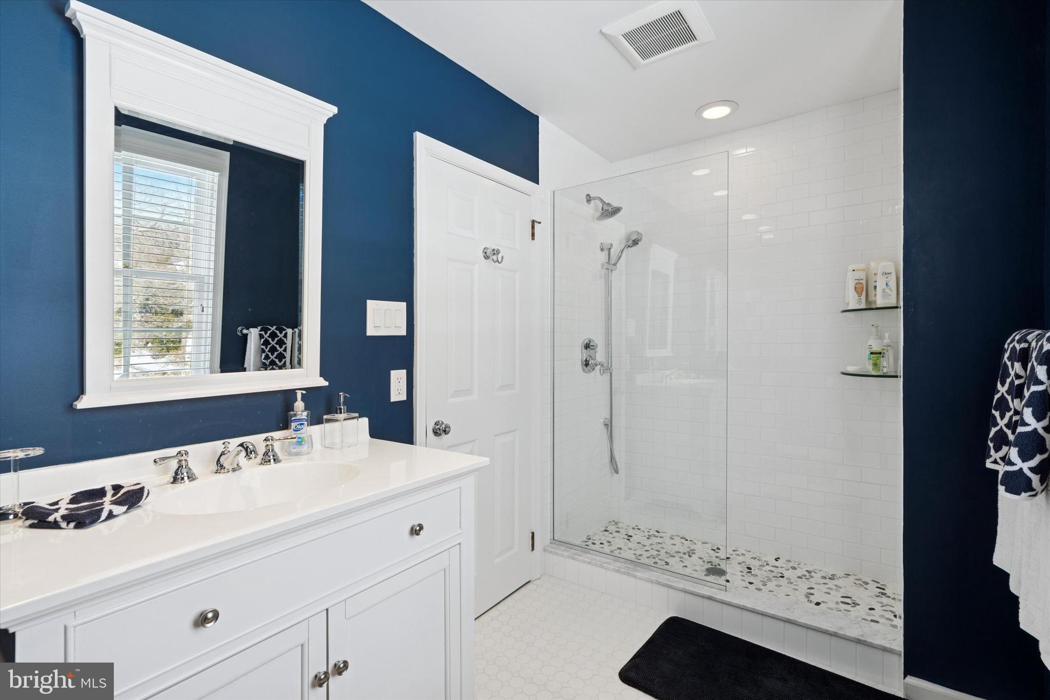 736 Woodleave Road Bryn Mawr, PA 19010 - Photo 29 of 44 a bathroom with a sink double vanity and a mirror