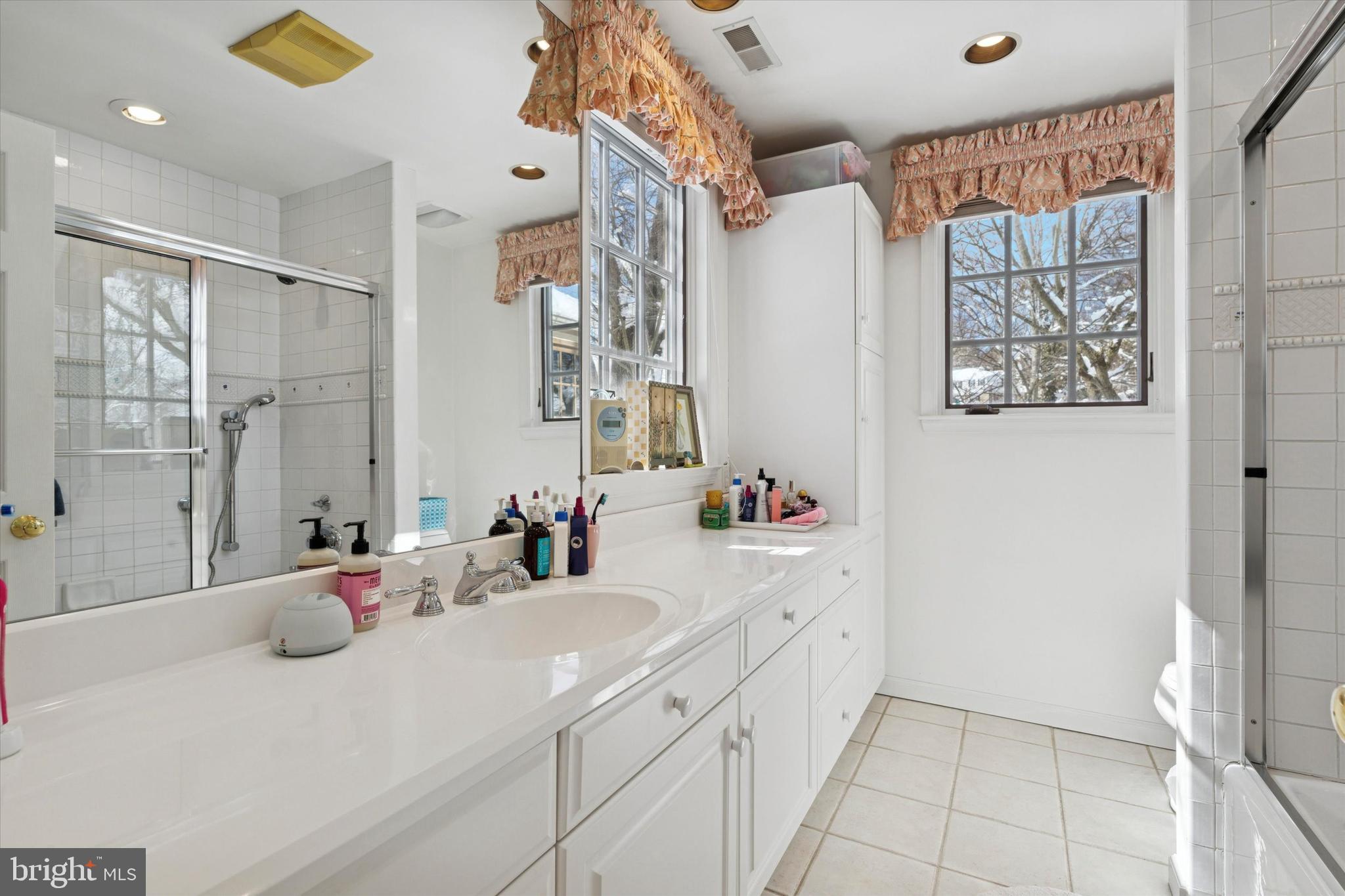 736 Woodleave Road Bryn Mawr, PA 19010 - Photo 32 of 44 a bathroom with a double vanity sink mirror and