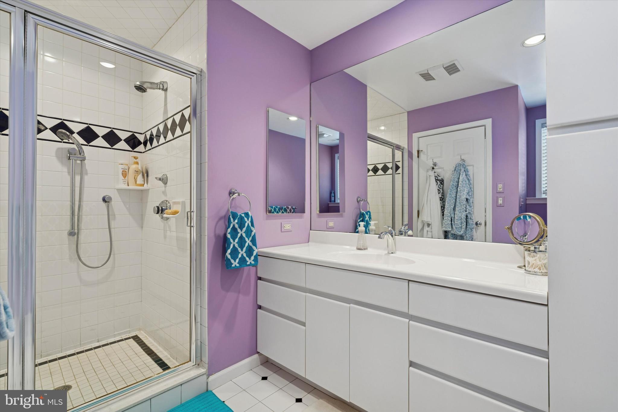 736 Woodleave Road Bryn Mawr, PA 19010 - Photo 36 of 44 a bathroom with a sink vanity granite shower and a mirror