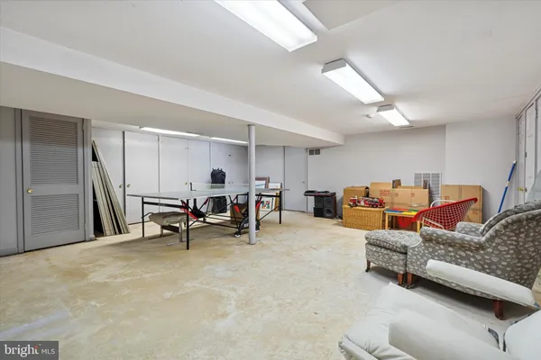 a living room with furniture and a rug