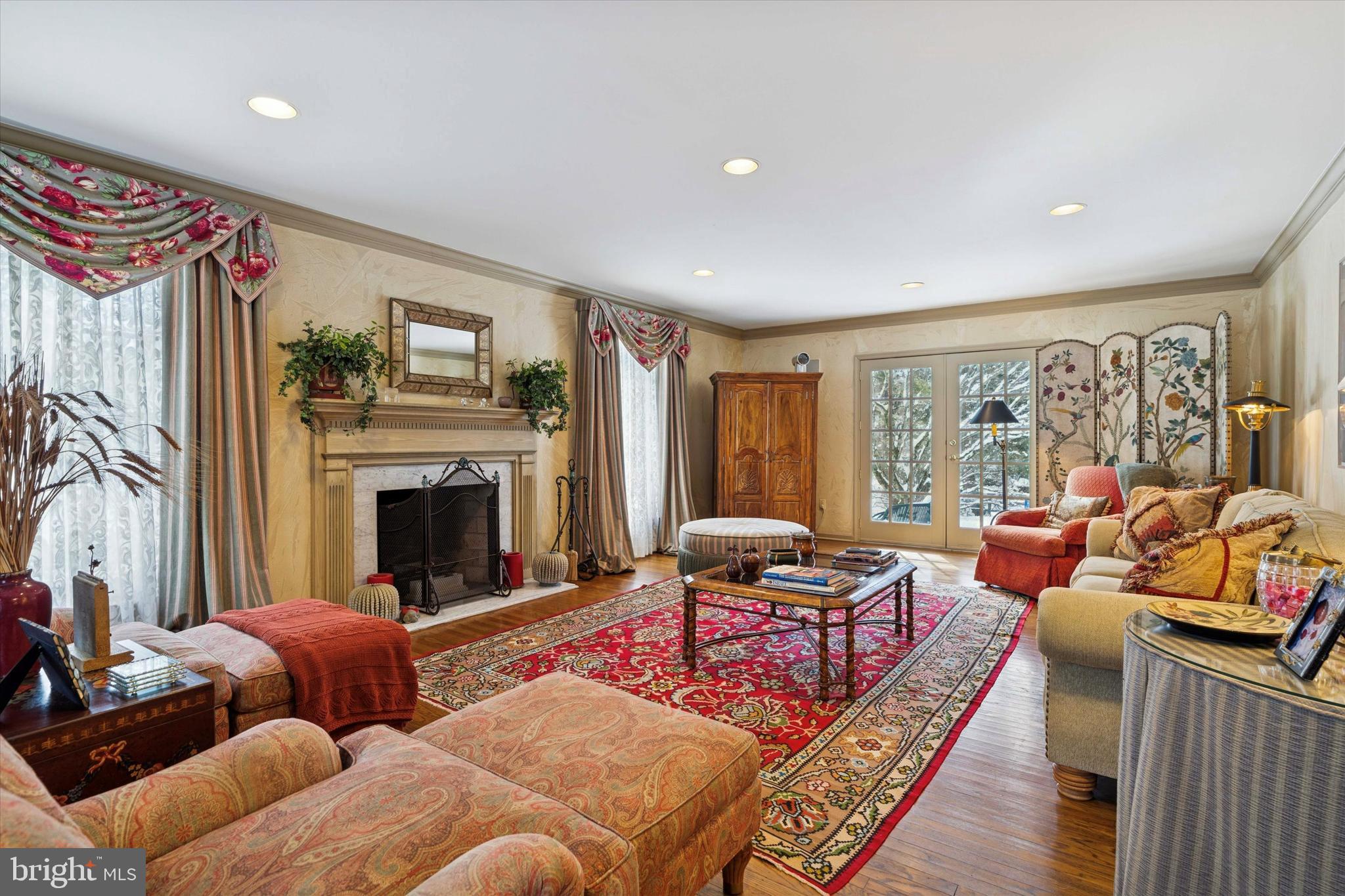 736 Woodleave Road Bryn Mawr, PA 19010 - Photo 4 of 44 a living room with furniture fireplace and a large window