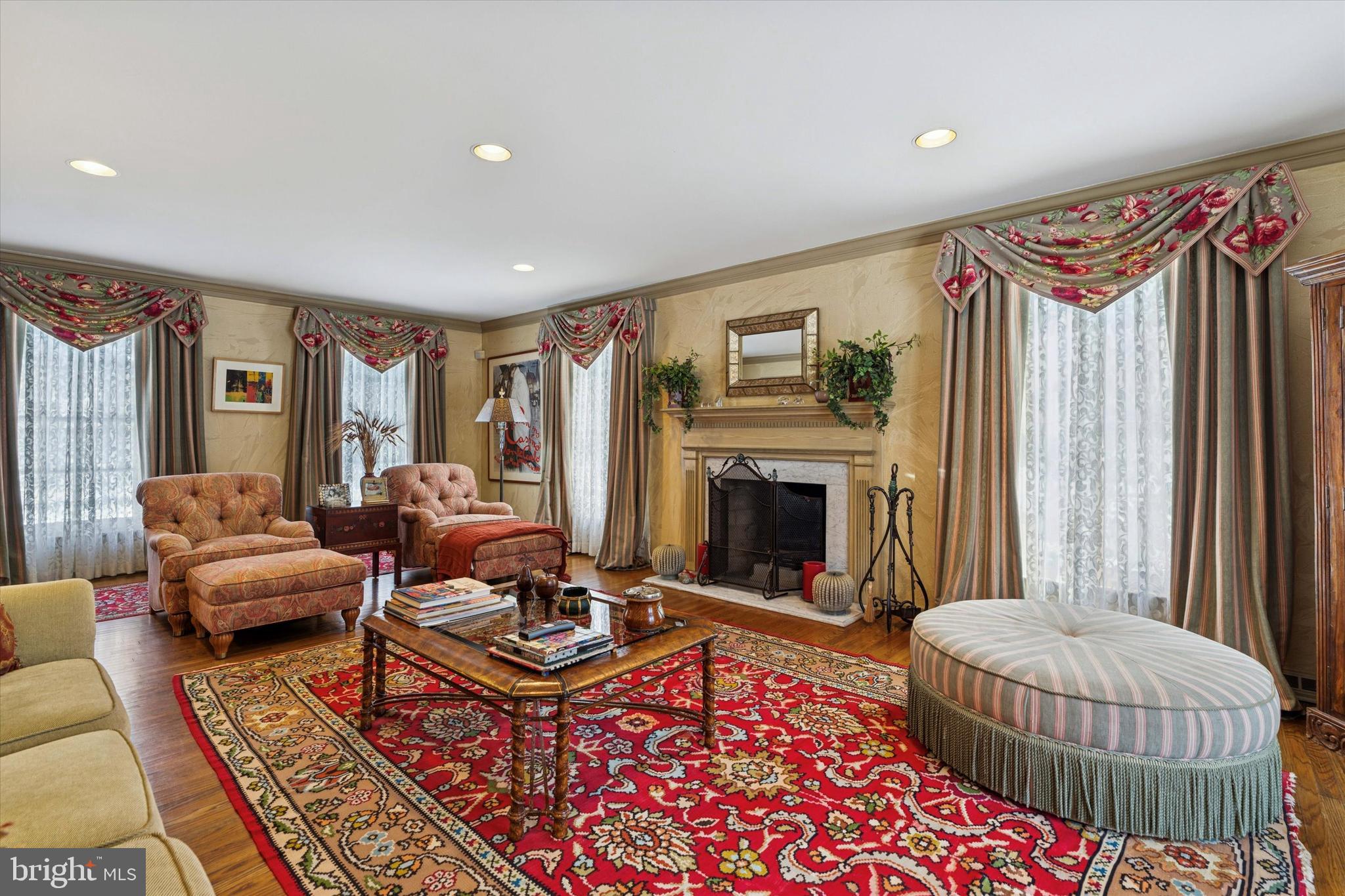 736 Woodleave Road Bryn Mawr, PA 19010 - Photo 6 of 44 a living room with furniture a rug and a fireplace