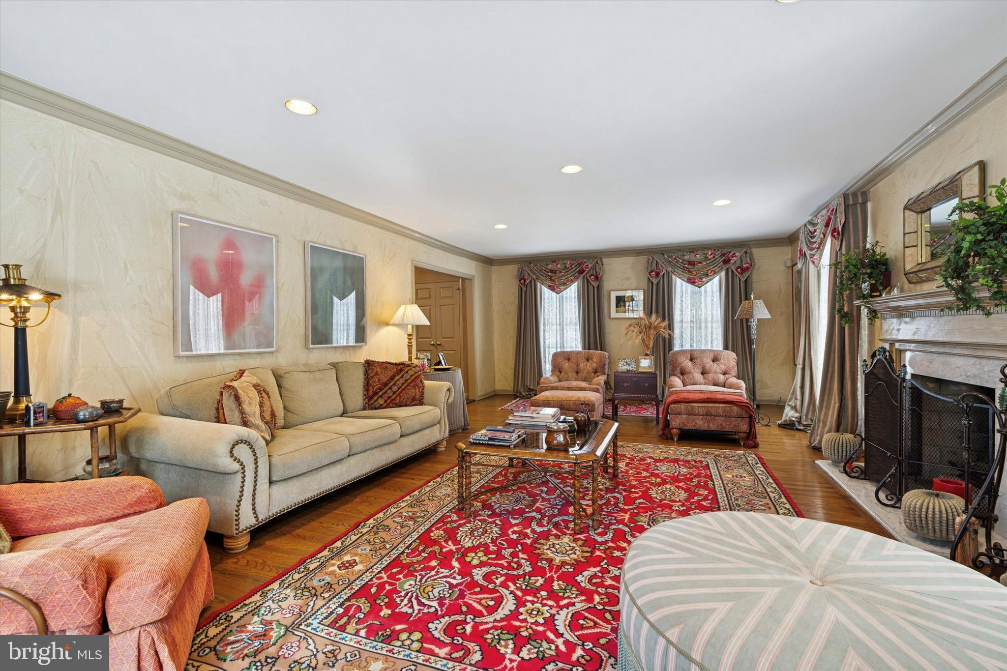 736 Woodleave Road Bryn Mawr, PA 19010 - Photo 7 of 44 a living room with furniture a flat screen tv and a fireplace