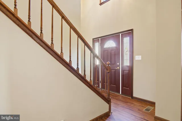 a view of staircase with wooden floor and staircase