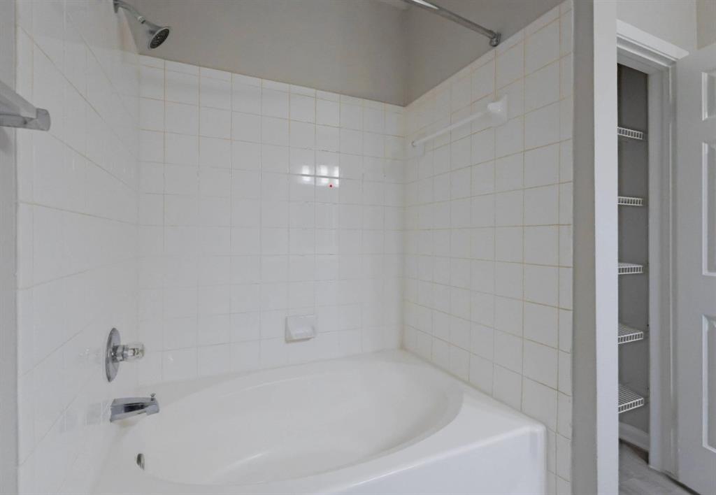 10505 I-35 Frontage Road South, Unit 1737 Austin, TX 78747 - Photo 18 of 23 a white bath tub sitting in a bathroom