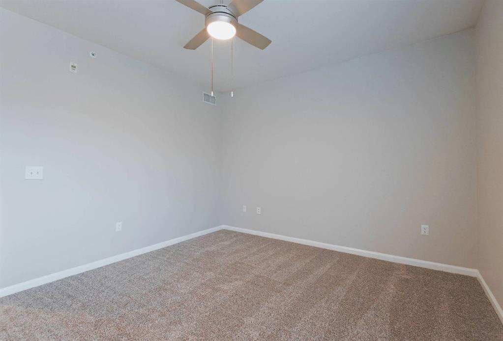 10505 I-35 Frontage Road South, Unit 1737 Austin, TX 78747 - Photo 19 of 23 an empty room with a fan