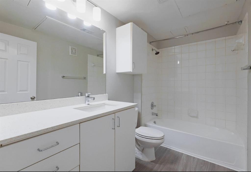 10505 I-35 Frontage Road South, Unit 1737 Austin, TX 78747 - Photo 21 of 23 a bathroom with a sink a toilet and shower