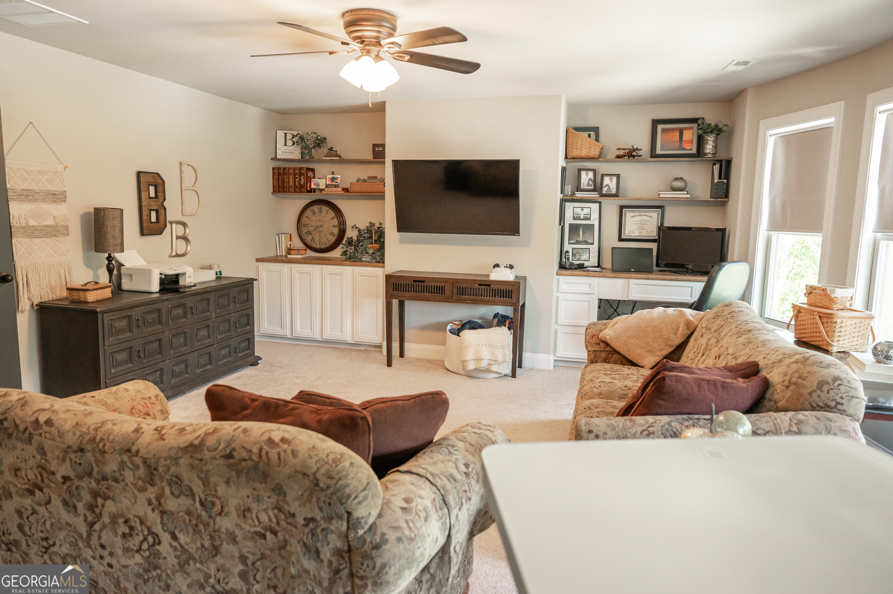 415 EAS Way Fayetteville, GA 30215 - Photo 37 of 70 a living room with furniture and a flat screen tv