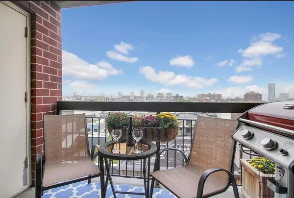 a view of a balcony with chairs