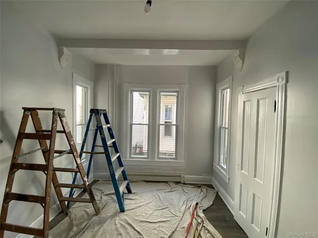 a view of a livingroom with furniture and window