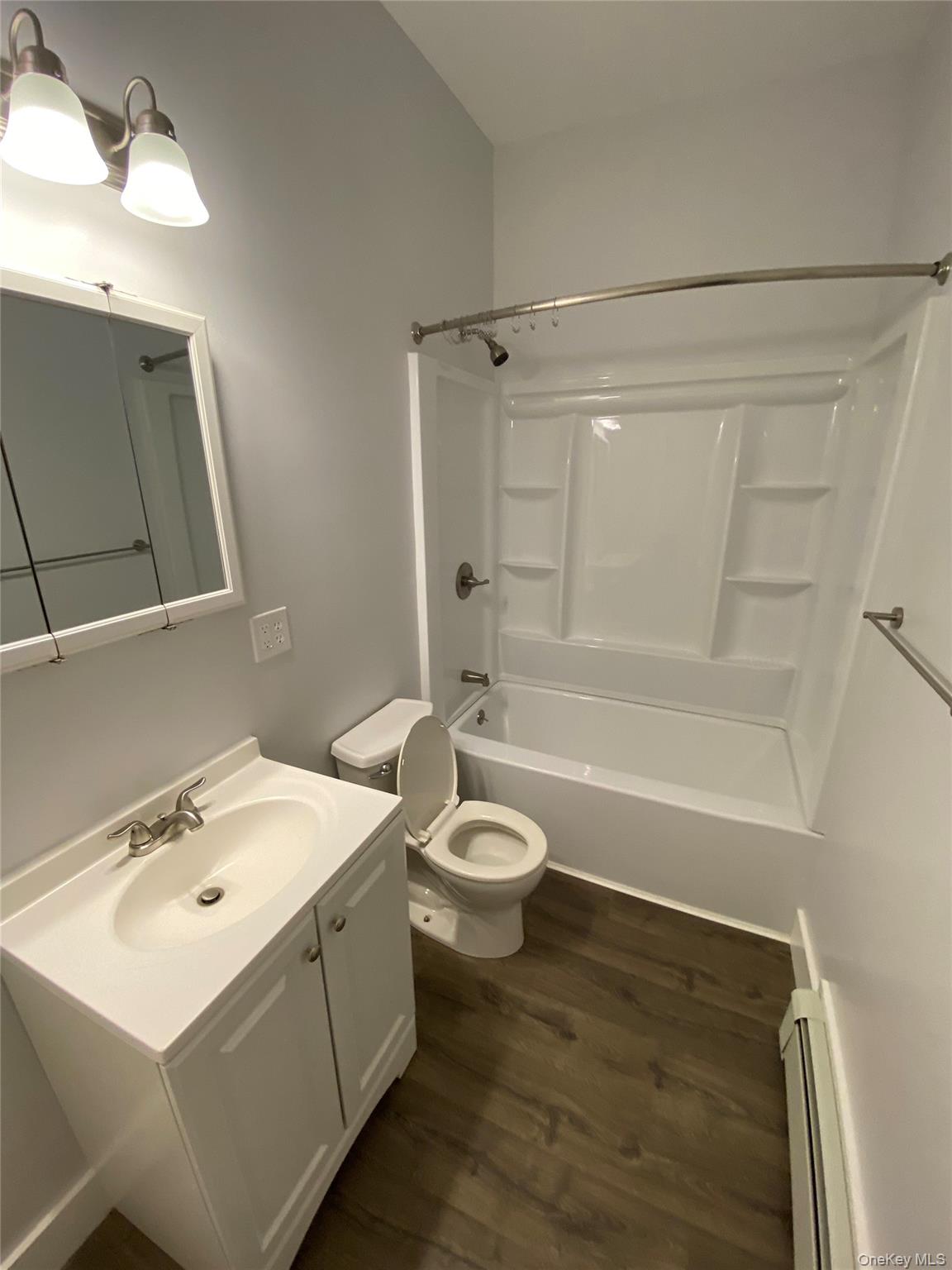 126 Garden Street Poughkeepsie, NY 12601 - Photo 10 of 13 a bathroom with a sink a toilet and shower
