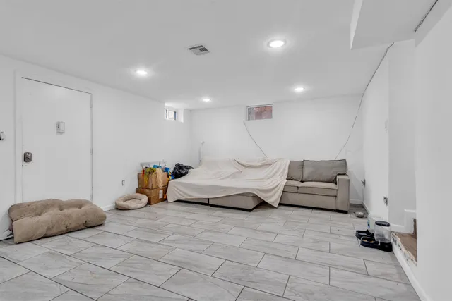 a bedroom with furniture and a couch