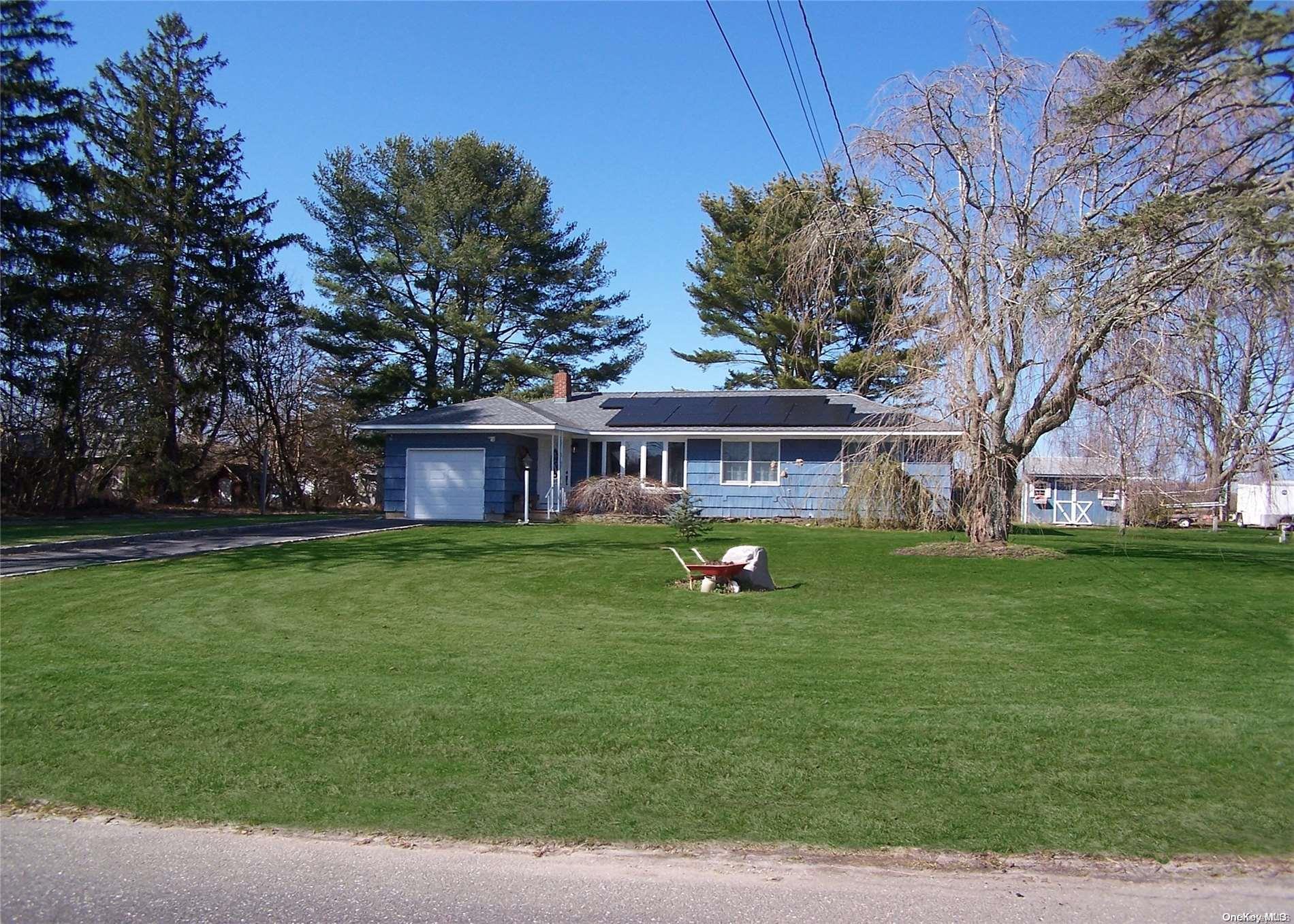 a view of a house with a backyard