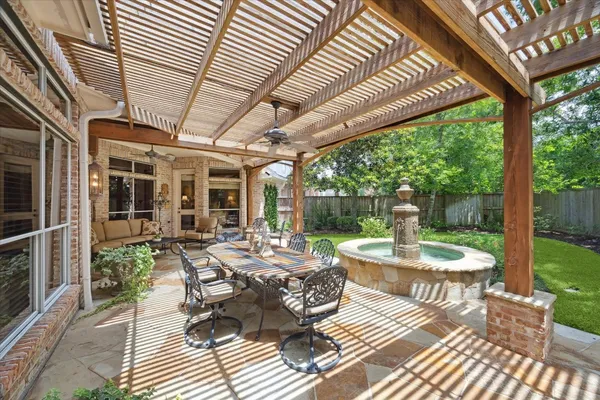 a view of a patio with table and chairs and wooden floor