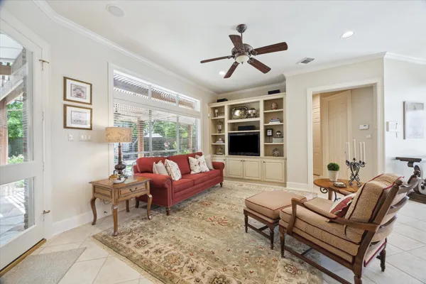 a kitchen with granite countertop a center island a dining table and chairs