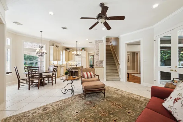 a kitchen with kitchen island granite countertop a sink stove and cabinets