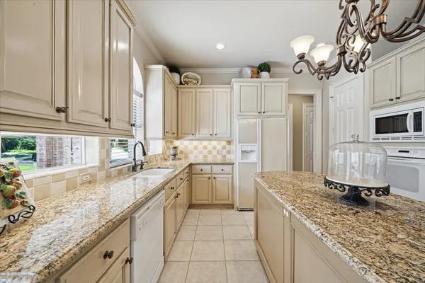 a bathroom with a granite countertop sink mirror and double