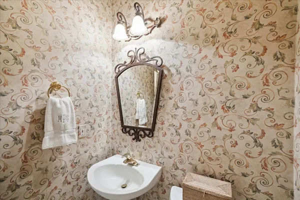 a bathroom with a sink a vanity and a mirror