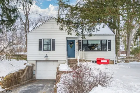 a view of a house with a snow in a yard